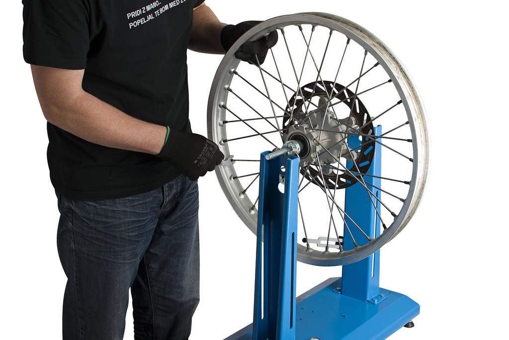 Stand for motorcycle wheel alignment